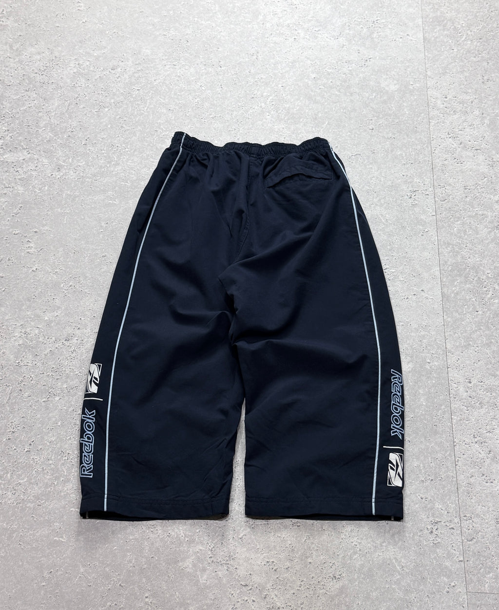 Vintage 2000s Reebok Spellout 3/4 Track Shorts (S)