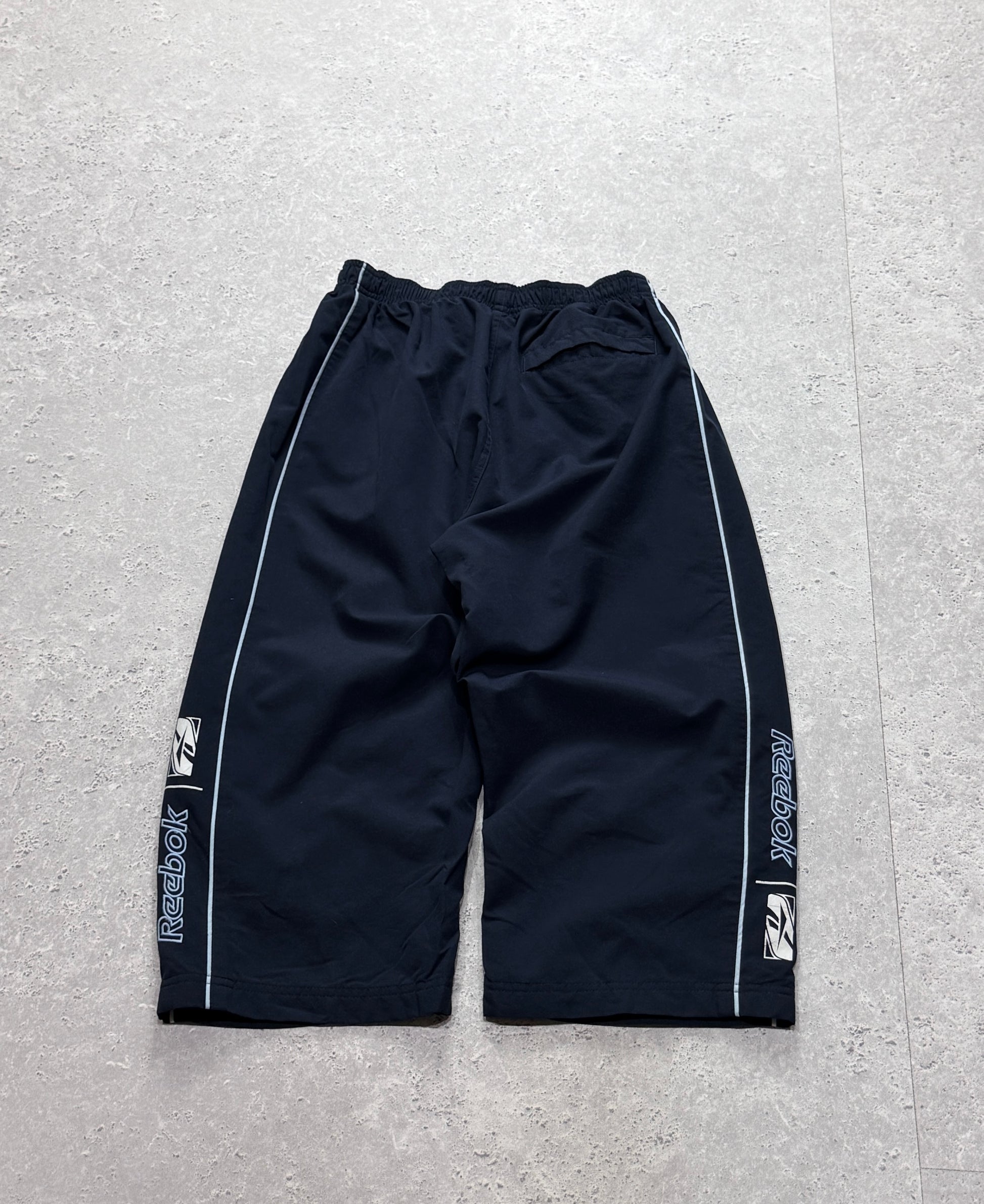 Vintage 2000s Reebok Spellout 3/4 Track Shorts (S)