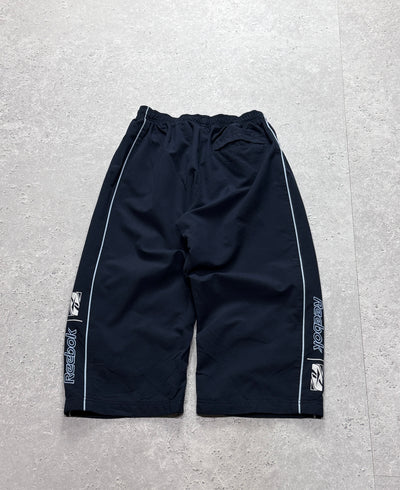 Vintage 2000s Reebok Spellout 3/4 Track Shorts (S)