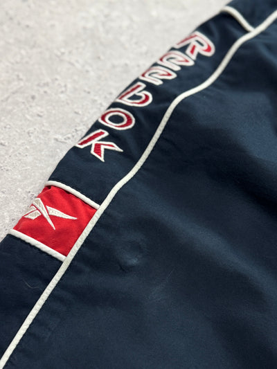 Vintage 2000s Reebok Spellout 3/4 Track Shorts (M)