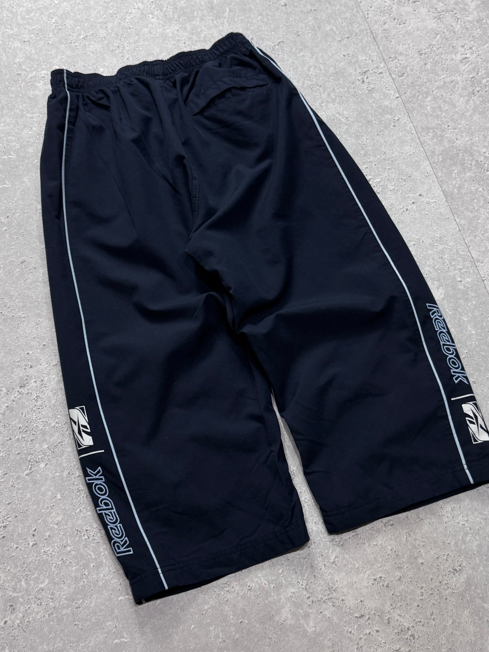 Vintage 2000s Reebok Spellout 3/4 Track Shorts (S)