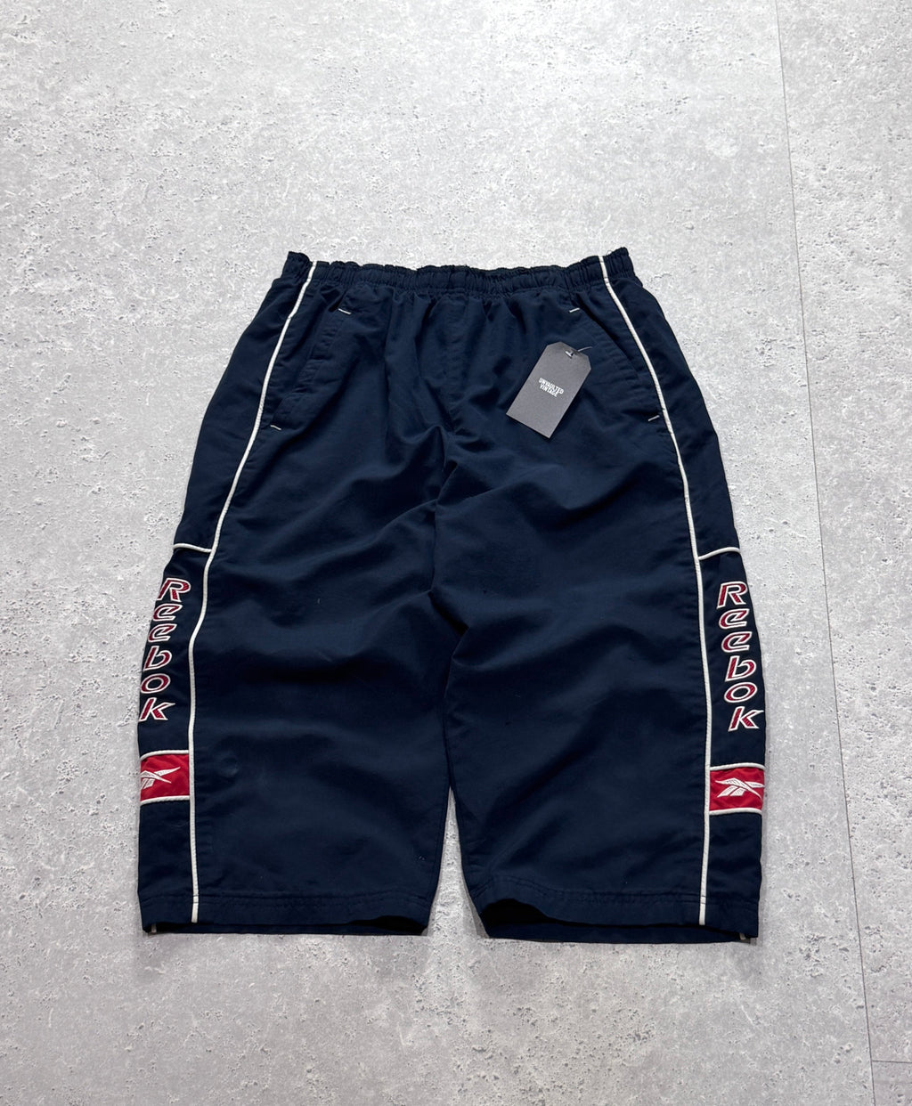 Vintage 2000s Reebok Spellout 3/4 Track Shorts (M)