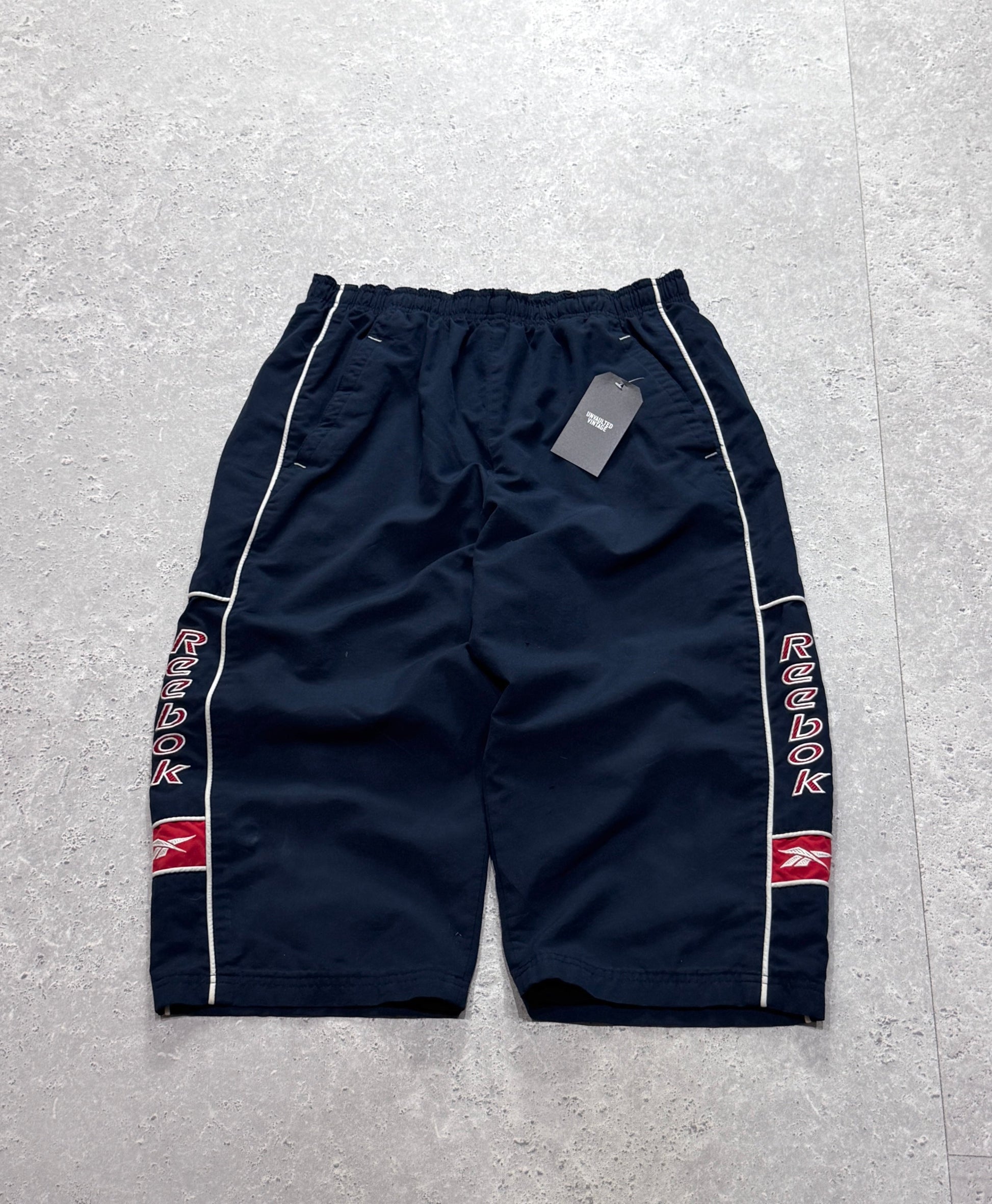 Vintage 2000s Reebok Spellout 3/4 Track Shorts (M)
