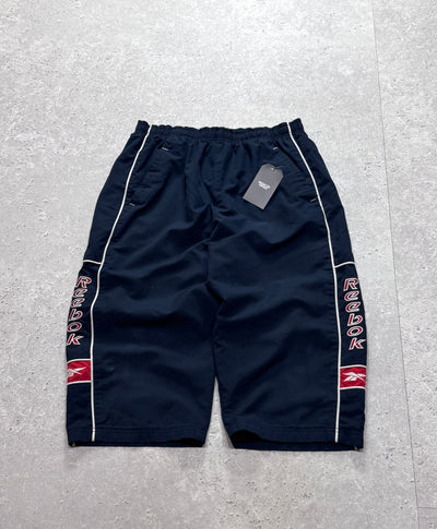 Vintage 2000s Reebok Spellout 3/4 Track Shorts (M)