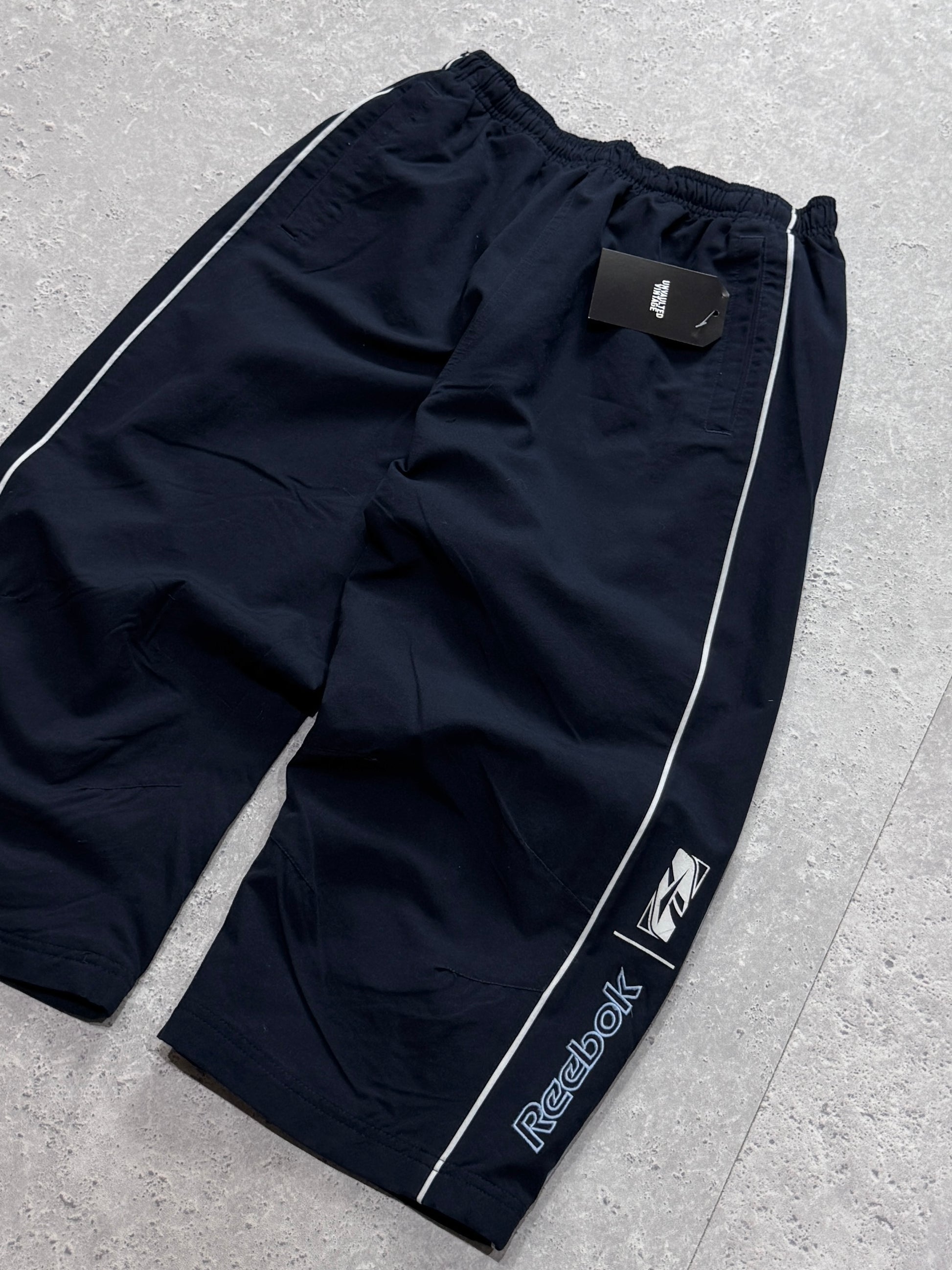 Vintage 2000s Reebok Spellout 3/4 Track Shorts (S)