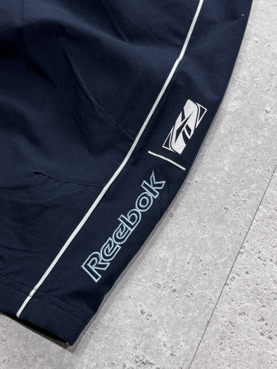 Vintage 2000s Reebok Spellout 3/4 Track Shorts (S)