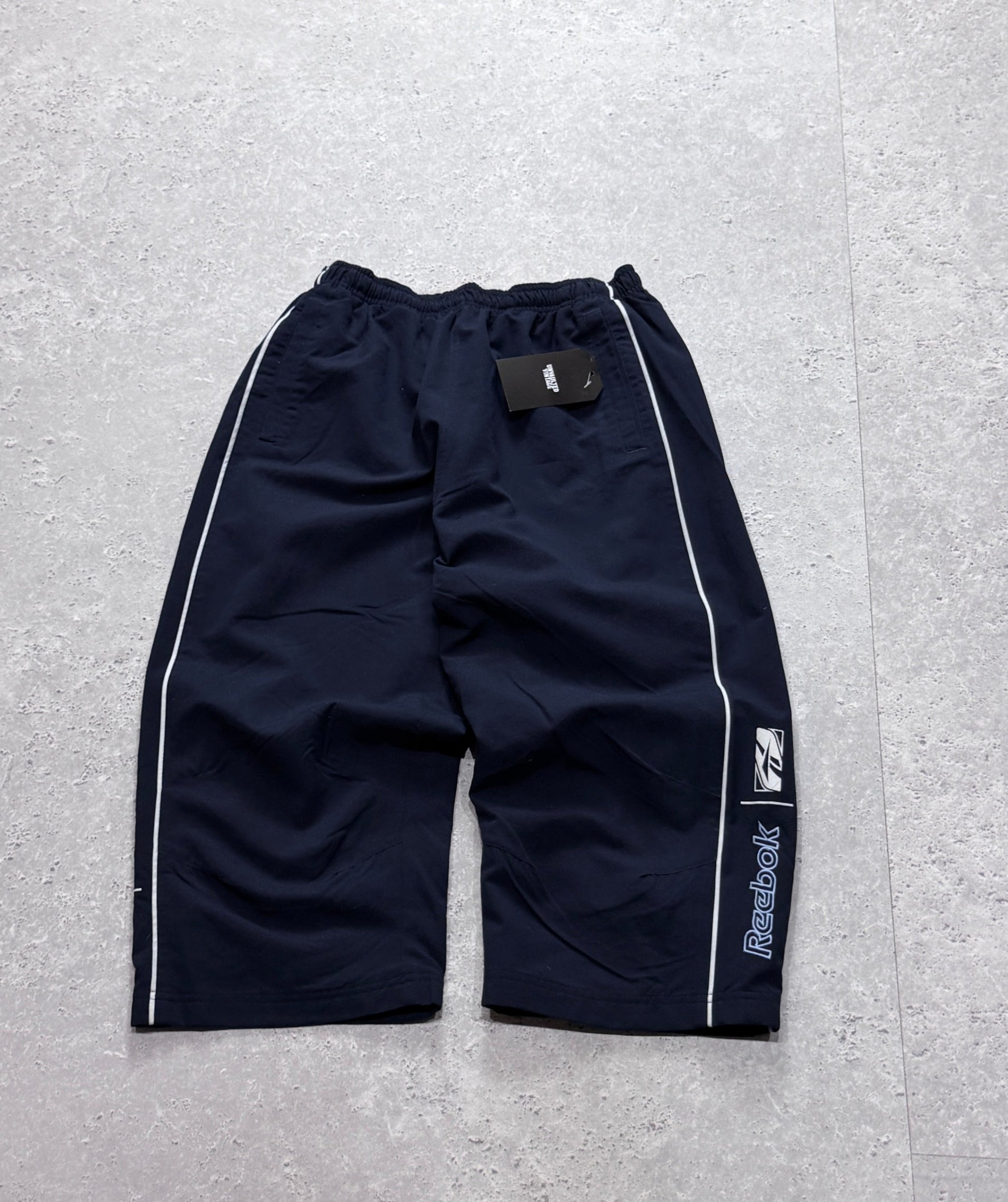 Vintage 2000s Reebok Spellout 3/4 Track Shorts (S)