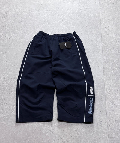 Vintage 2000s Reebok Spellout 3/4 Track Shorts (S)