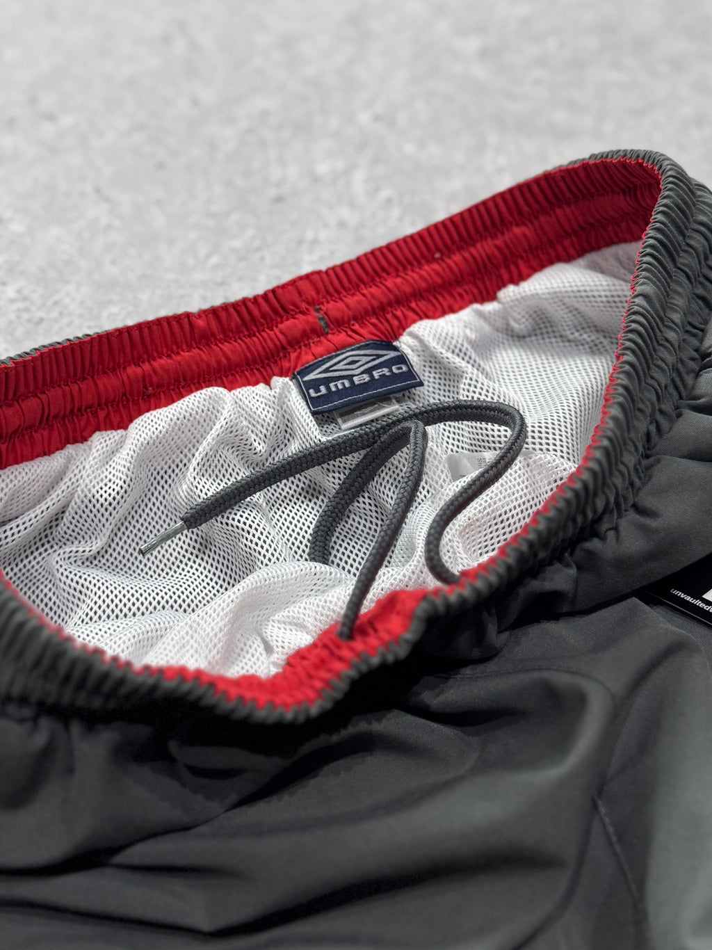 Vintage 2000s Umbro Spellout Track Pants (L)
