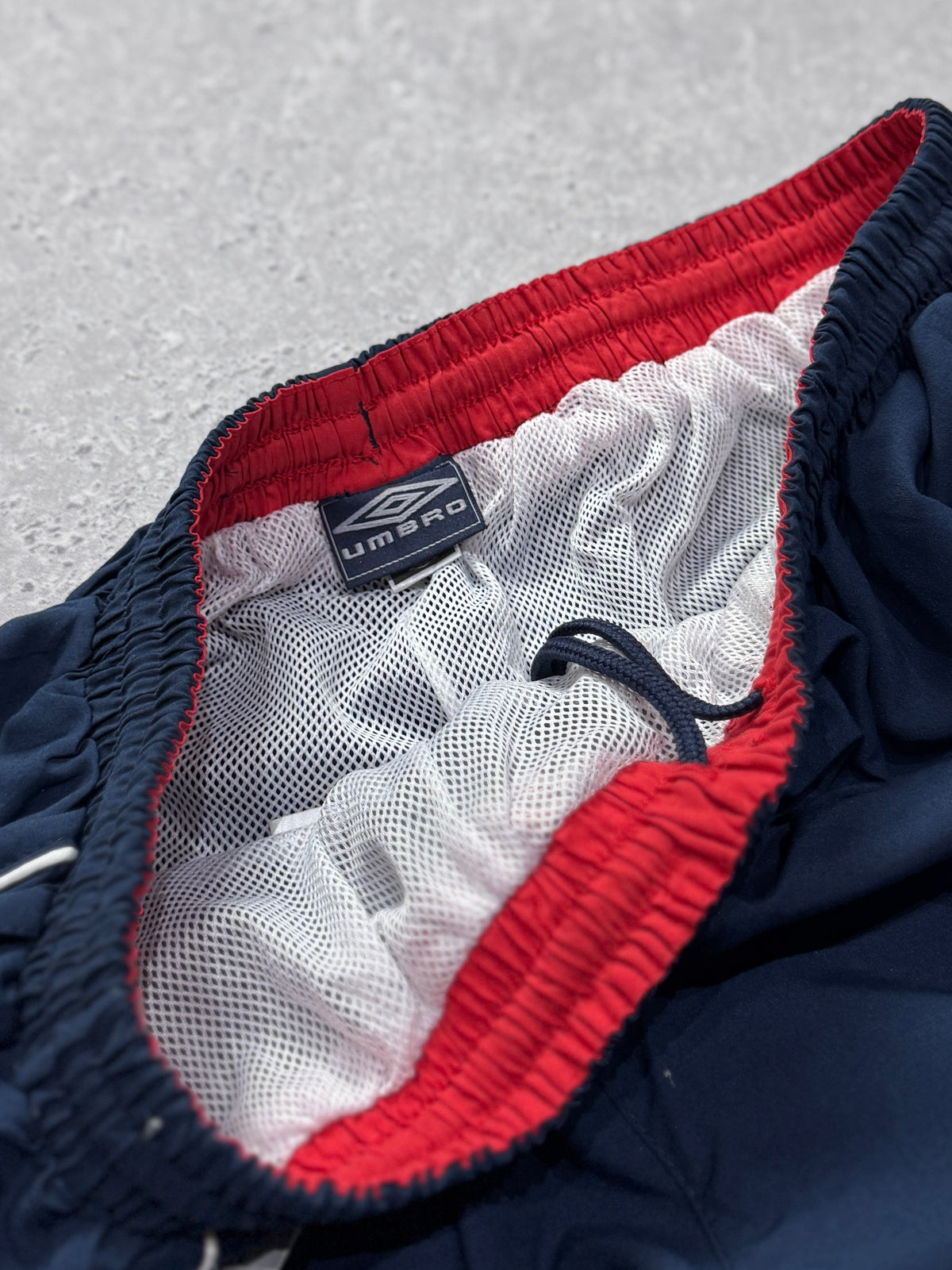 Vintage 2000s Deadstock Umbro Spellout 3/4 Track Shorts (32”)